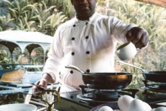 head chef preparing breakfast in our open kitchen at living heritage koslanda (1)